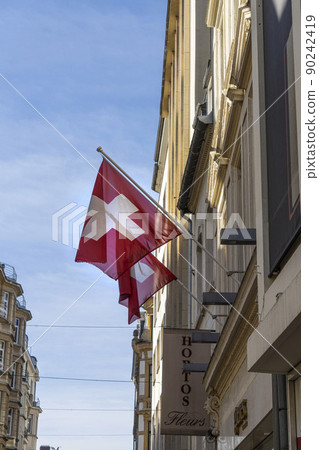 Swiss flags are waving Swiss flags are waving 90242419