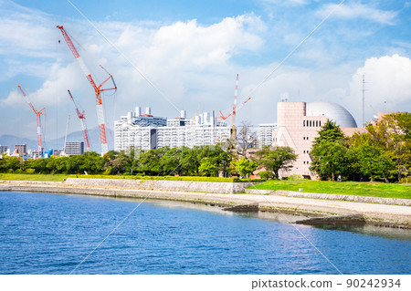 It is a view of the north direction (Yokogawa Station) from Aioi Bridge. The crane is the construction site for the soccer stadium. Hiroshima 90242934