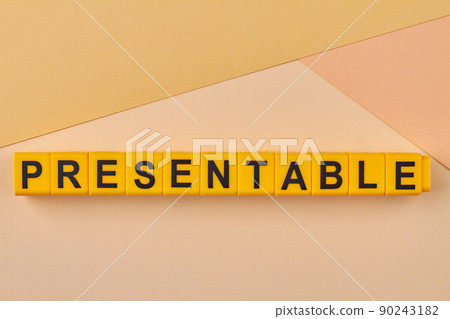 Word presentable written on yellow blocks against color background. 90243182