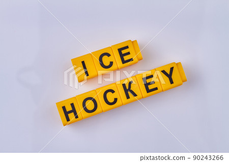 The inscription ice hockey written on yellow cubes isolated on white background. The inscription ice hockey written on yellow cubes isolated on white background. 90243266