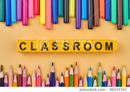 The word classroom written on yellow cubes. School education concept. The word classroom written on yellow cubes. School education concept. 90243341