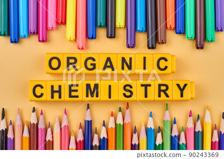 The inscription Organic chemistry written on yellow cubes against color background. The inscription Organic chemistry written on yellow cubes against color background. 90243369