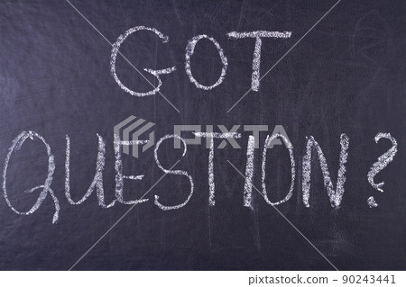 Got question handwritten inscription with white chalk on black chalkboard. 90243441