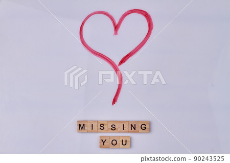 Red hand drawn heart and inscription missing you on vintage wooden cubes. Red hand drawn heart and inscription missing you on vintage wooden cubes. 90243525