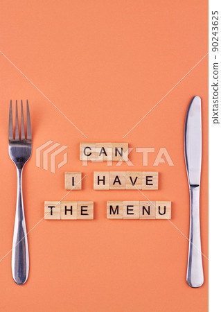 Wooden cubes with the inscription Can I have the menu and cutlery. 90243625