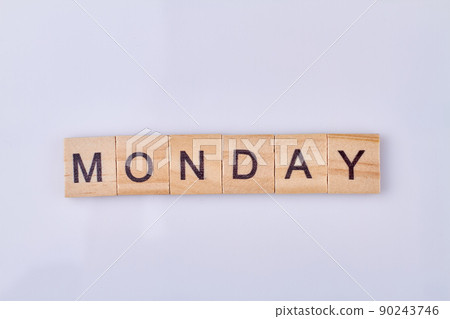Mondey word written with vintage wooden cubes and black letters. Mondey word written with vintage wooden cubes and black letters. 90243746