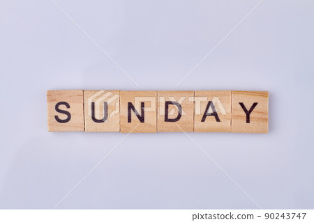 Sunday word made with wooden cubes and black letters. Sunday word made with wooden cubes and black letters. 90243747