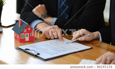 Cropped shot financial advisor consulting with client for real estate investment. Insurance and real estate concept 90245159