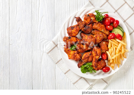 roast chicken wings with french fries and veggies 90245522