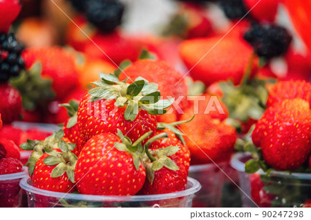 Selective focus. fresh strawberries, raspberries and blackberries in a glass. Summer Beach Food 90247298