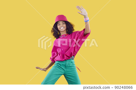 Happy African dancer girl in funky outfit dancing and having fun in fashion studio 90248066