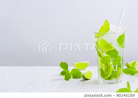 Fresh non-alcoholic mojito with ice and straw in glass 90248189