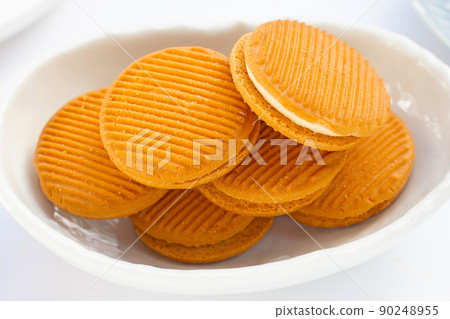 Custard cream sandwich biscuits on white background. Custard cream sandwich biscuits on white background. 90248955