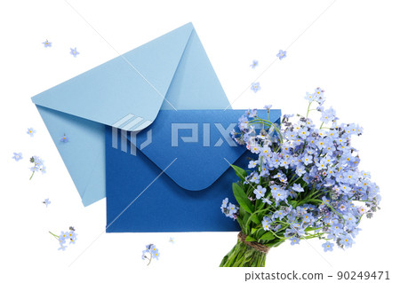 Blue envelope with wedding invitation card or birthday letter decorated with bouquet of wild forget me not flowers on white. Flat lay. Top view. 90249471