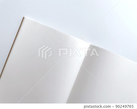 Open plain notebook and white background Open plain notebook and white background 90249765