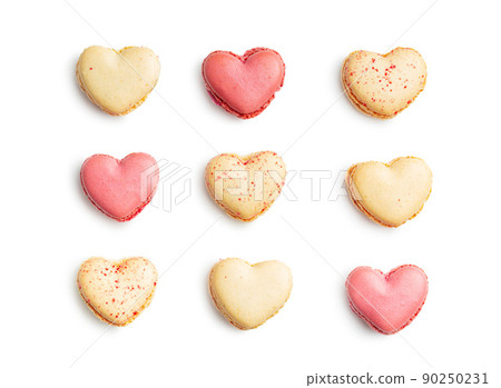 Heart shaped Sweet macarons isolated on white background. 90250231