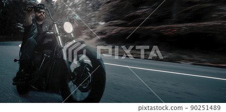 Serious brutal biker riding motorbike in speed highway in summer evening time. Vintage cinematic background and dramatic cloudy sky. Concept of fashion, style and hobby Serious brutal biker riding motorbike in speed highway in summer evening time. Vintage cinematic background and dramatic cloudy sky. Concept of fashion, style and hobby 90251489