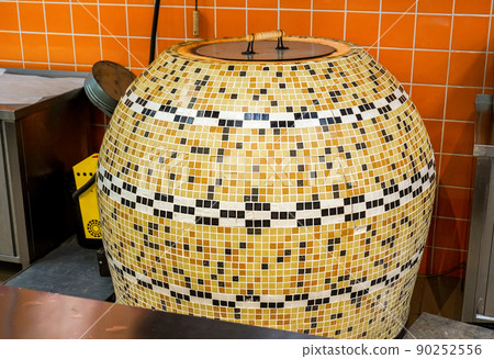 Large tandoor oven for making flat unleavened white bread Large tandoor oven for making flat unleavened white bread 90252556