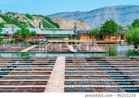 fish farm with commercial fishing and a fish restaurant on a river in a mountain valley fish farm with commercial fishing and a fish restaurant on a river in a mountain valley 90255238