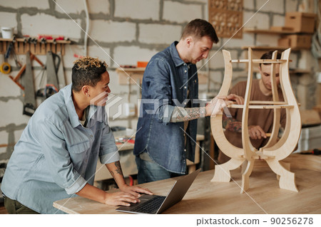 People Designing Wooden Piece in Shop People Designing Wooden Piece in Shop 90256278