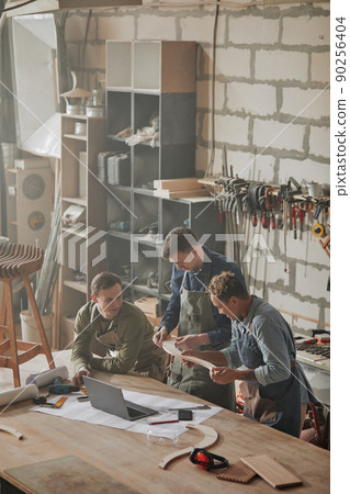 Artisans Collaborating in Shop Artisans Collaborating in Shop 90256404