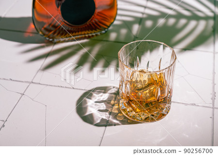 Whiskey with ice in glasses 90256700