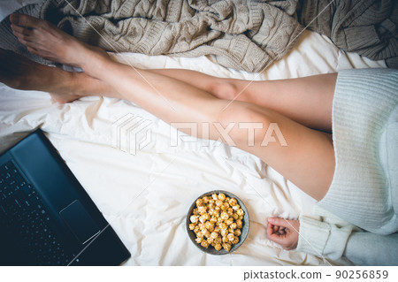 Young woman in her bed 90256859