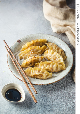 Asian dumplings with soy sauce Asian dumplings with soy sauce 90256871