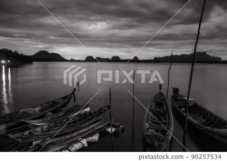 Wooden boats before sunrise at Sam Chong Tai. Phang-nga Wooden boats before sunrise at Sam Chong Tai. Phang-nga 90257534