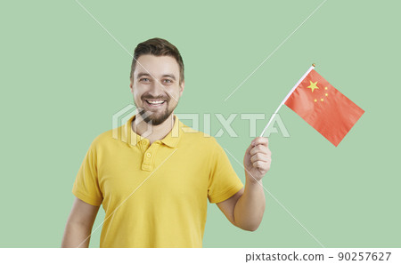 Smiling man entrepreneur with Chinese flag Smiling man entrepreneur with Chinese flag 90257627