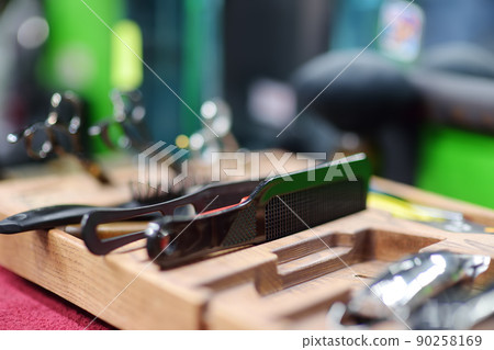 Tools set for cutting and making hairstyle barbershop. Services of a professional stylist. Fashion haircut 90258169