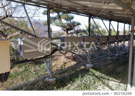 Behind the solar panel Behind the solar panel 90258206