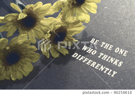 Motivational and inspirational quote with sunflowers on wooden desk. Motivational and inspirational quote with sunflowers on wooden desk. 90258618