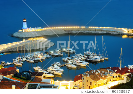 Amazing aerial view with sea, yachts and lighthouse on Lustica bay on blue hour. Amazing aerial view with sea, yachts and lighthouse on Lustica bay on blue hour. 90258927