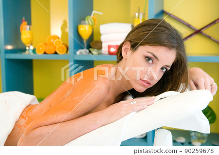 young woman having a treatment for her skin in a beauty salon young woman having a treatment for her skin in a beauty salon 90259678