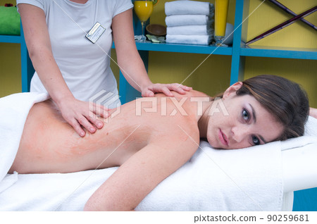young woman having a treatment for her skin in a beauty salon young woman having a treatment for her skin in a beauty salon 90259681