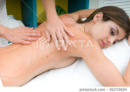 young woman having a treatment for her skin in a beauty salon young woman having a treatment for her skin in a beauty salon 90259684
