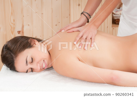 young woman in a spa getting a treatment for her skin 90260341