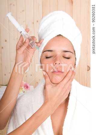 woman in a beauty center receiving an antiaging treatment woman in a beauty center receiving an antiaging treatment 90260381