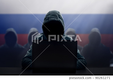 Russian hacker at laptop. Malware and virus. 90261271