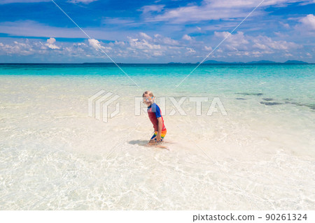 Kids playing on beach. Children play at sea. 90261324