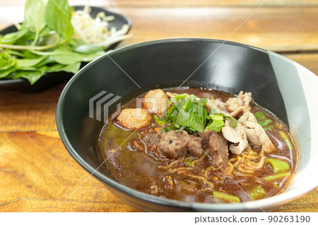 Beef and meatballs yellow noodles with blood soup. Thai food Beef and meatballs yellow noodles with blood soup. Thai food 90263190