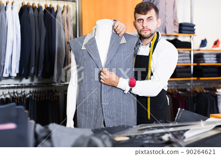 Handsome adult fashioner working in atelier Handsome adult fashioner working in atelier 90264621