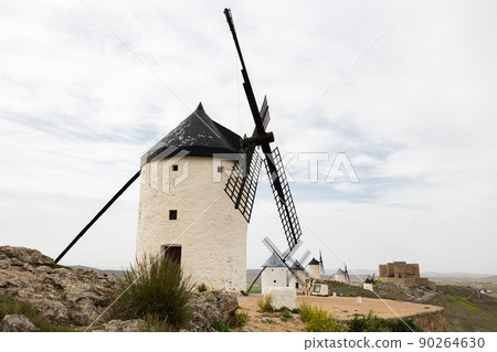 View of windmills of Consuegra in Castilla-La Mancha View of windmills of Consuegra in Castilla-La Mancha 90264630