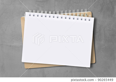 Notebook placed on cement wall surface. Notebook placed on cement wall surface. 90265449
