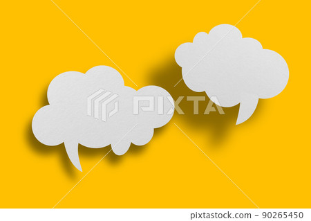 White paper in speech bubble shape set against yellow background. 90265450