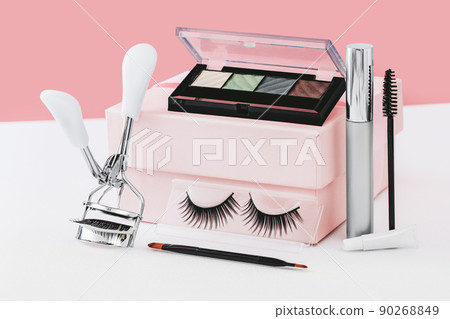 Beauty and makeup eye shadows lashes cosmetics on pink 90268849