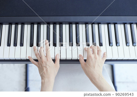 Japanese woman playing the piano in the living room 90269543