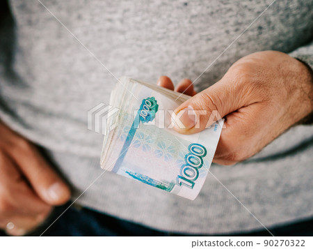 Hands hold rubles Hands hold rubles 90270322