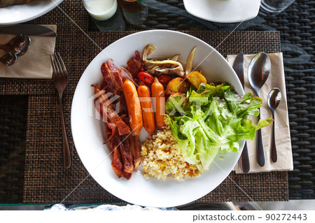 Breakfast on a plate at the hotel 90272443